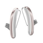 Paire d’aides auditives design blanc et or rose de la gamme Premium +
